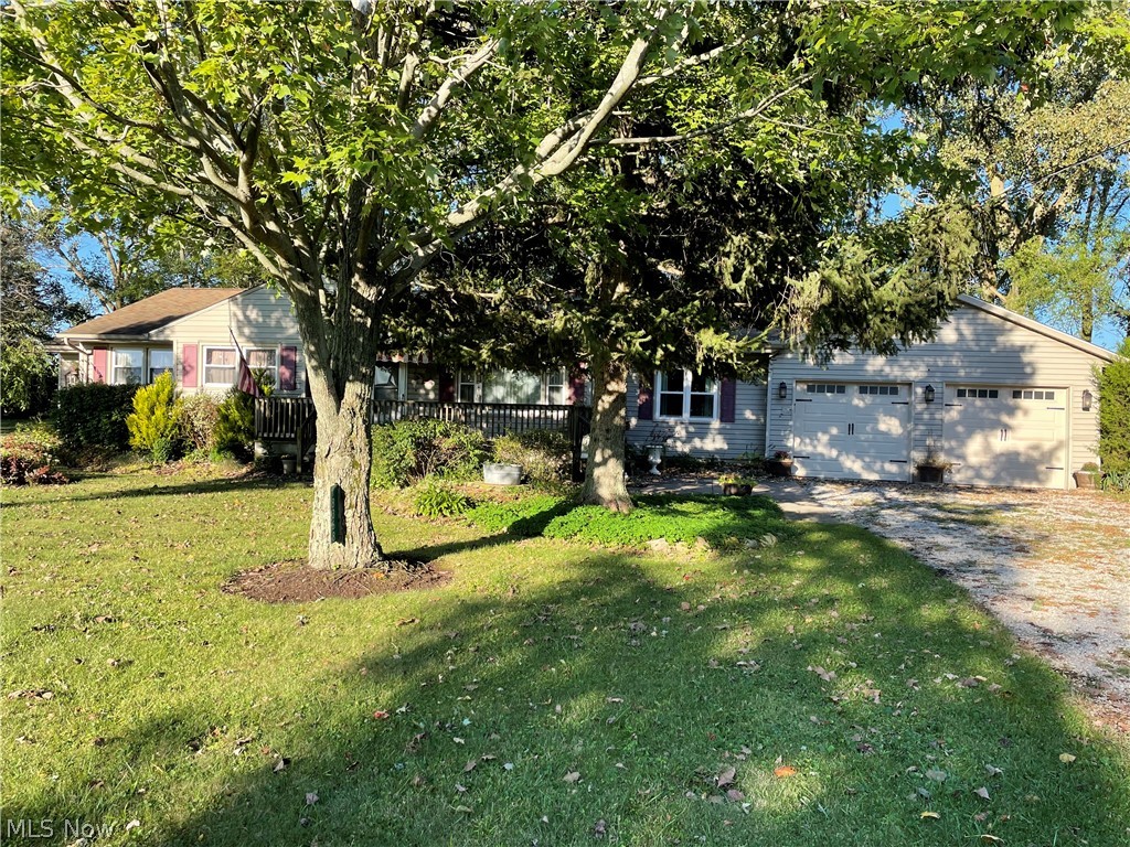 This is the affordable ranch on acres in the country you've been looking for. This special find features a updated eat-in kitchen, a spacious living room with beautiful hardwood floors, all 3 bedrooms have hardwood floors and the master bedroom has an oversized master bath with a walk-in closet and a walk-in shower. The home originally had only one bath but the second one was an a real nice addition built to the existing home. There is a family room the perfect room separated from the living room so you don't have to share the TV or maybe just go there to read. A sun room is attached to the family room. There is a partial basement, replacement windows, updated kitchen and baths and a 2 car garage attached garage with 2 single doors making for an easy fit for both vehicles. The property has 2 lots, 1 acre each, 2 acres total. Very fairly priced for a quick sale. Don't miss out on this Camden Township country property! See it today!