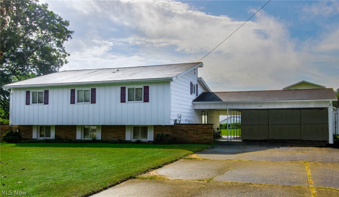 This beautiful tri-level home in Stockport is ready for it's new owners. Meticulously maintained and clean as can be, this home offers 3 bedrooms, 2 1/2 baths, large living room and dining room and an additional large family room on lower level. Just off the lower level family room is a half bath and laundry room. With over 2400 sq foot of living space, this home offers lots of room for entertaining! On the upper level you will find three good-sized bedrooms and two full baths, one at each end of the hall. Upstairs is also a large desk/storage space that overlooks the kitchen area, a perfect spot to do homework! Features include a beautiful wood burning fireplace in living room, a gas log fireplace in family room, exposed brick, galley style kitchen with custom cabinetry, masonite siding, central air with humidifier, large unfinished basement with wood burning fireplace, two sliding doors to concrete patio areas and a large barn/workshop. The barn/workshop has three levels and could ea