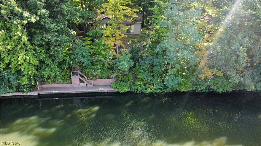 Just in time for Spring! A well-loved & maintained Lakefront home for 27 years at the south-end of Lake Roaming Rock's “No-Wake Zone”. This Ranch home is nestled within mature trees. With a circular paved drive offers ample vehicle or trailered boat parking. A small Shed up front is convenient for yard tools, some boating equipment & caring for the many flowers. Stepping into the interior experience the vaulted space with a stone gas fireplace reaching high to the ceiling to add to a more open feel. The Dining area and Kitchen complete this space as designed as the Greatroom.  There are Granite countertops and that includes on the Island, designed to accommodate counter seating.  Adding to the openness is the Full-glass slider doors that open to a 3-Season room that has continuous windows running on 3 sides. This receives the full benefit of the western lake facing side for the tree filtered afternoon Sunlight.  From this room or out to the Deck with the care-free Composite decking you