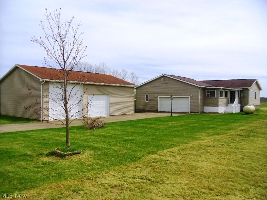 2001 RANCH HOME ON 1.5 ACRES WITH GARAGE AND 32 X 40 BUILDING

COLUMBIANA COUNTY ~ ELKRUN TWP ~ BEAVER LOCAL SCHOOLS

Very good 2001 frame ranch home of approx. 1638 sq. ft. Hickory kitchen with built in dishwasher, microwave, tile floor and breakfast nook. SS glass top range stays with the home. Formal dining room. Large living room. 3 bedrooms (master with full bath). Enclosed sun room overlooking the back yard and acres of farm field. New engineered wood flooring throughout the home. Full walkout basement with cement block foundation, concrete floors, 200 amp breaker box electric, LP gas forced air heating system and water softener. Shingle roof and vinyl siding. 2 car attached frame garage with overhead door and opener. Also a 32x40 pole garage with 2 overhead doors, electric, concrete floors,  shingle roof and vinyl siding. A 8x8 porta building. Concrete driveway, well and septic system. All situated on 1 ½ acres of land in a quiet country setting surrounded by active farm lan