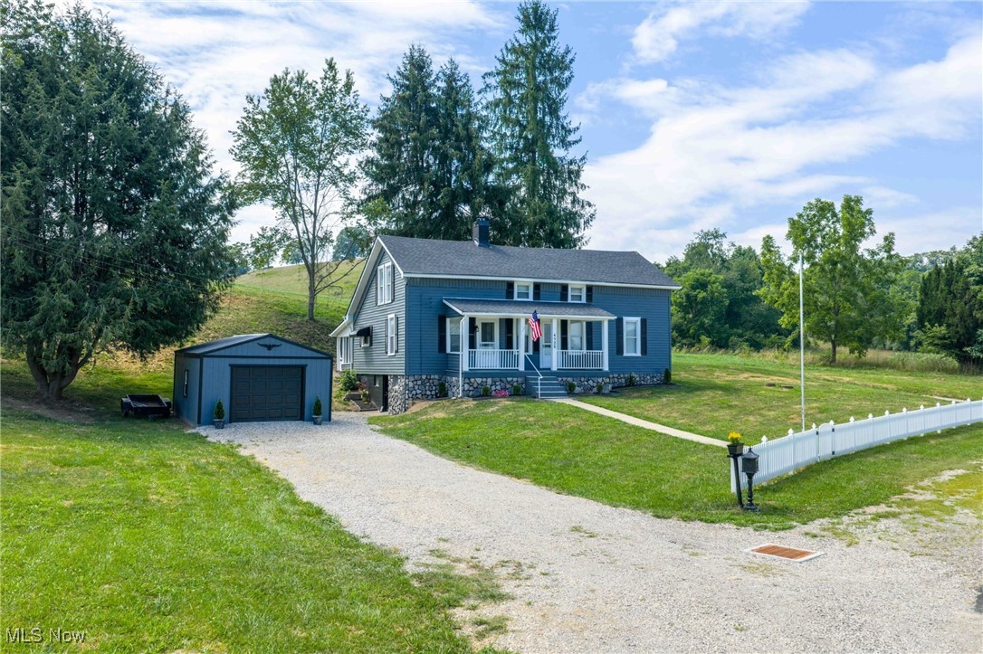 Fantastic country setting with 1.5+/- acres. Remodeled 5 bedroom, 2 bath farmhouse. Fresh paint with wood laminate flooring throughout the main level. Spacious living room. New white Top Craft kitchen with marble counters opens to the formal dining room. Main floor bathroom features clawfoot tub and marble counters. Second main floor bath boats walk in shower and marble counters. Main floor laundry room off the mud room. Spacious main floor master bedroom. Large family room on the second floor with decorative fireplace. 4 bedrooms also located on the 2nd floor. 24 X 11 screened in patio leads to the covered patio and firepit. Beautiful country setting with scenic views. Additional updates include new drywall and light fixtures throughout, new pecks plumbing, new 200 amp electric, 2 new furnaces and 2 air conditioners, new roof and more. Exclude 2 electric fireplaces. Room sizes are estimates.