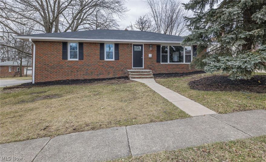 Welcome home to 4430 Orchard Park Drive located in the heart of Parma.  Nothing to do but move right in to this recently renovated 3 bedroom ranch home.  Upon entry you will immediately notice the openness this floorplan has to offer.  Large Livingroom area features laminate flooring, has been freshly painted throughout and features a large picture window giving off tons of natural lighting.  Open kitchen features white, soft close cabinets & drawers, granite countertops, backsplash and new laminate flooring.  3 nice sized bedrooms all with new carpeting and plenty of closest space for your convenience.  Gorgoeus main bath features his and her sinks with beautiful tile throughout.  Lower level features a large partially finished space with new carpeting, a gorgeous built in wet bar area perfect for entertaining and a half bath with recessed lighting.  Large corner lot with a two car detached garage.  Newer roof with updated mechanicals and windows.  Located just minutes from shopping,