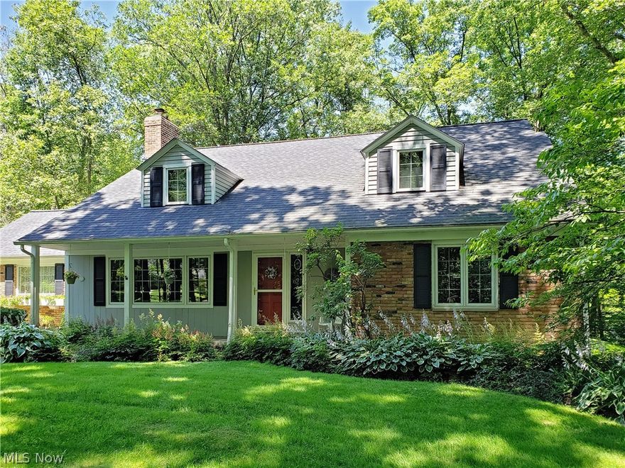 Move right in to this picture perfect cape cod in Moreland Hills! Nestled on 1.8 serene acres, this Metzger-built home provides a perfect blend of comfort and convenience with valuable updates throughout. A cozy family room with a beamed ceiling and a wood-burning fireplace greets you at the front of the house. A chef's delight, the kitchen was thoughtfully updated with Amish-made cabinetry including a baking center, an island with a bar, and a breakfast nook. The focal point of the kitchen is a wall of windows that frames the backyard, providing the ambiance of an alpine lodge in winter months. Off of the kitchen, the open living and dining room connects to a gorgeous 4-season sunroom with views of the backyard. A mudroom, a bedroom, and a full bathroom complete the first floor. Upstairs, you will find two spacious bedrooms with large closets and newer laminate floors, plus another full bathroom and a convenient laundry room. There is also additional storage available in the unfinishe