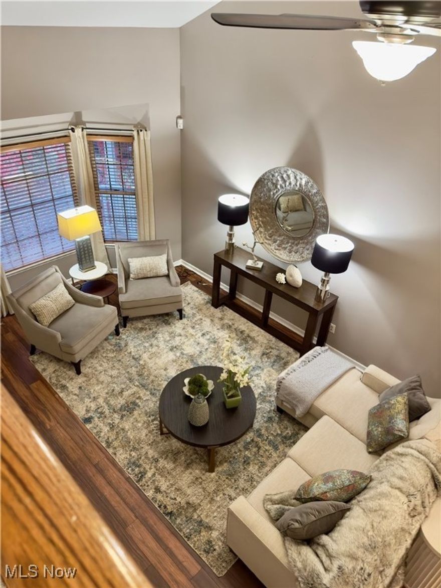 Move-in ready colonial - featuring a welcoming covered front porch. Inside on the main floor you will find the living room and dining room with vaulted ceilings and a beautiful bay window in the living room. The updated kitchen includes white cabinetry, center island, stainless steel appliances, and is open to the family room which features a gas fireplace and doors leading outside to the large deck and views of the fenced in back yard.  Additionally, on the main floor is a half bath, laundry room, and access to the basement and two car garage. On the second floor you will find the spacious primary bedroom with vaulted ceilings and an attached full private bath.  Two additional bedrooms and a second full bathroom are also located on the second floor.  This fantastic home is situated in a beautiful neighborhood with mature trees, a park with walking paths. Shopping, restaurants, Metroparks and Cuyahoga Valley National Park are just minutes away.