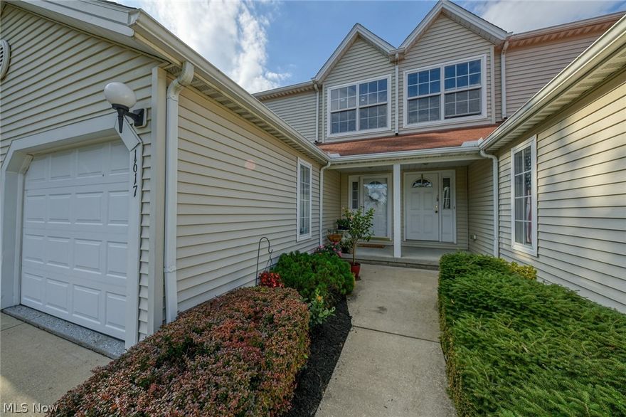 Picture perfect condo in the desirable Maplewood Development! Convenient Streetsboro location keeps you close to all the amenities & highways while being nestled back in a gorgeous wooded area. You will love walks through the neighborhood, enjoying the views and charming ponds. Walk in the front foyer & take in all of the stunning updates! Kitchen offers brand new black stainless top of the line appliances, including range, microwave, dishwasher, & fridge. Lots of counter space & cabinetry w/ a glass backsplash as a finishing touch. The open floor plan flows into the dining & living room area.  Sleek laminate flooring runs all through the lower level. Sliders to the patio provide wonderful natural lighting & a serene view. There's a spacious half bath w/ beautiful updates on the main floor as well as garage access. Down to the lower level for an incredible bonus living space! Perfect as a family room, media room, workout space or guest space. There is even a full 3 piece bathroom on th