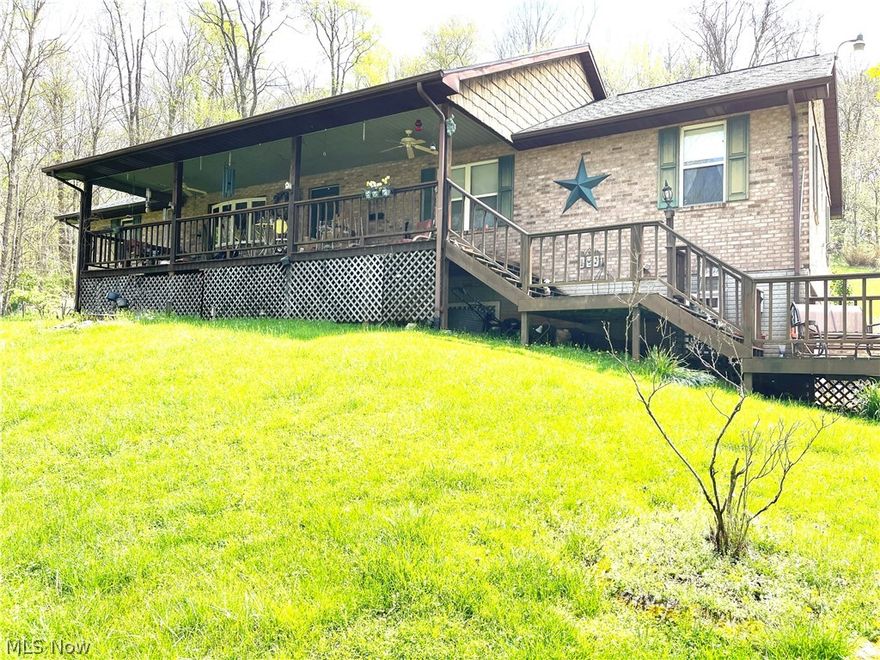 How many times do you hear someone say they want a house with a little bit of land?  Well, here might be just that opportunity.  This 1996 brick-built home sits on just a tad over 5 acres.  The large spacious front porch/deck allows one to sit and soak up the nature views that surround the home.  The home will greet you with a spacious great room that hosts skylights and a vaulted ceiling to accentuate the size.  The layout offers a master bedroom with two walk in-closets on one side of the home along with a spacious master bath complete with jet tub, shower unit, double sinks, and vanity.  A sitting/informal family room area is also next to the master bedroom as well as a nice size laundry room.  As you cross the great room you will have access to an ample size pantry next to the kitchen, a guest bath, two bedrooms and access to a large loft room that oversees the great room. Need more room?  The lower level has endless possibilities!  While the rooms are not finished the layout is there with poured walls, high ceilings, a few unfinished rooms, and an unfished bathroom that offers a shower stall, toilet, and sink.  The garage space offers ample parking for two+ cars and lots of room for workbenches. Please note the property is being sold As-Is.  Schedule your showing today.