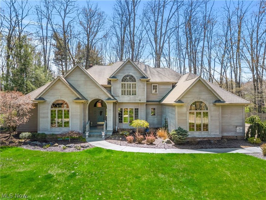 Absolutely PHENOMENAL 4 Bedroom/4 & 1/2 Bath Home with a 3 Car Heated Garage in desirable Park Harbour Development.  As you walk into the front door A Curved Staircase welcomes you which leads to the SPECTACULAR Great Room with Soaring Ceilings, Cherry Built In Cabinets, & Gas Fireplace, BREATHTAKING "New" Custom Kitchen with Quartz Countertops, Trendy Backsplash, Stainless Steel Appliances, & Breakfast Area, an UNBELIEVABLE Formal Dining Room with Double Tray Ceiling, and a MAGNIFICENT Private Office with Cherry Built Ins & 2 desk areas.  The First Floor Master Suite offers a Large Master Bedroom that offers Cathedral Ceilings with Architectural Detail, Built Ins, Walk In Closet, and an Incredibly CHARMING Master Bath with Double Sinks, Vanity Area, Floor to Ceiling Tile Shower/Steam Room & Jacuzzi.  A First Floor Laundry Room & Half Bath complete the first floor.  The Second Level offers a Large Guest Bedroom with a Private Bath & huge walk-in closet plus 2 other Bedrooms with a Jack-n-Jill Bath with convenient laundry chute.  The Lower Level offers a HUGE Rec. Room, Bonus Room, Full Bath, Tons of Storage and a Shop Area.  The Great Room, Kitchen, & Master Bedroom all have access to the TREMENDOUS Private Back Deck that leads to the Scenic Back Yard overlooking Mill Creek Park. This home has been very well cared for and updated with precision.  The Detailed Workmanship Includes STUNNING Hardwood Floors, Crown Moldings, Wainscoting, & Thick Trim work throughout.  This is the WOW!  Updates Include:  New Furnace (2)- 2004, New Central Air (2) - 2004, HWT - 2018.