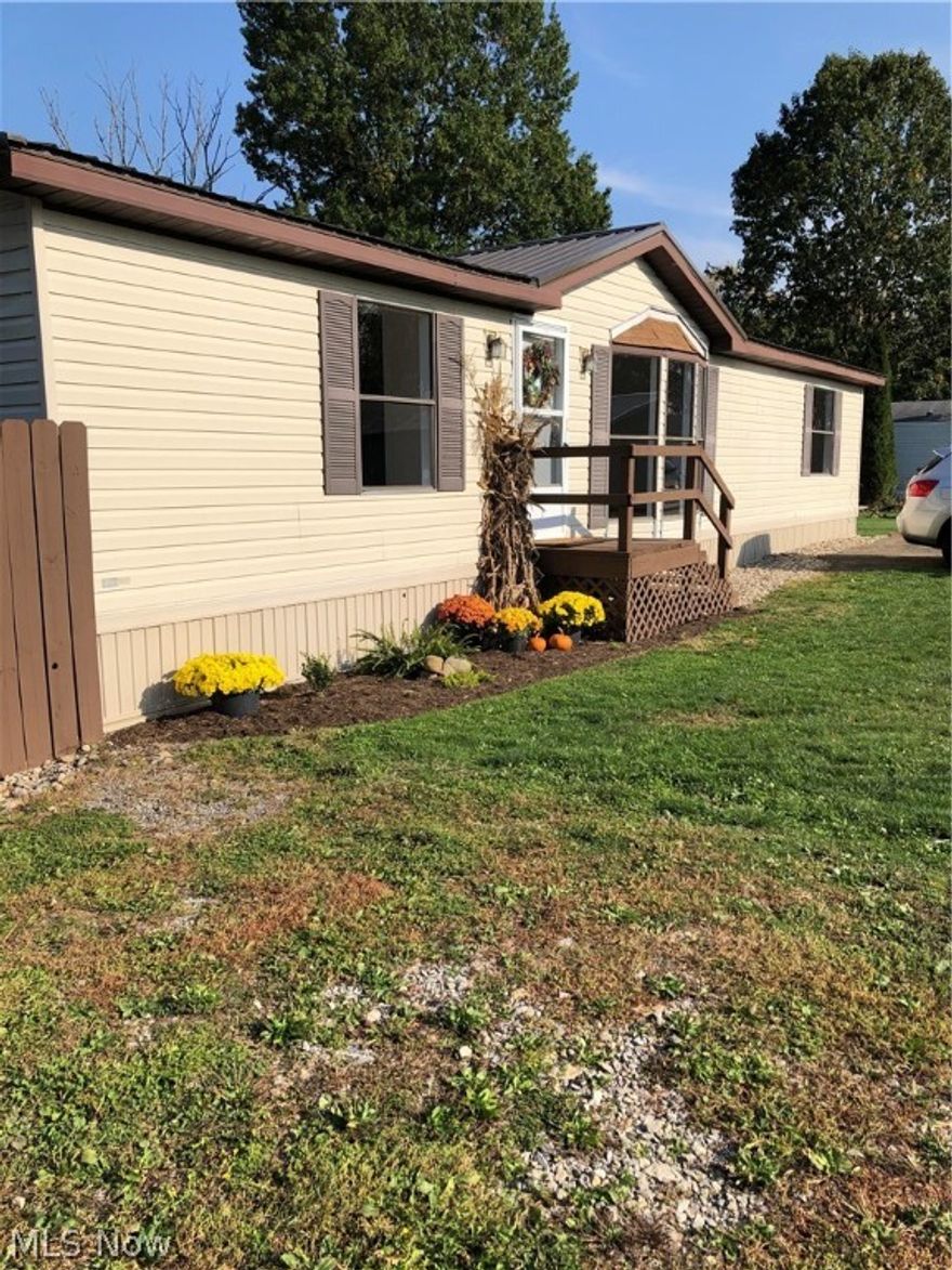 This is a NOW permanent attached home- it is on a foundation and has a metal roof
Why pay rent when you can be buying this newly redone Modular with 2 full baths, 3 bedrooms, and a laundry room.
OPEN concept living area!! The Bay window in the living room is beautiful!
 This new kitchen is a must-see --with new cabinets and raw edge shelves and fresh new countertops. All appliances stay!
 The master bath has been totally updated with new vanity and tub and flooring!
New flooring thru-out this home with easy-clean laminate. First-floor living!!!
Beach City is a great place 
 Fenced in yard!!
