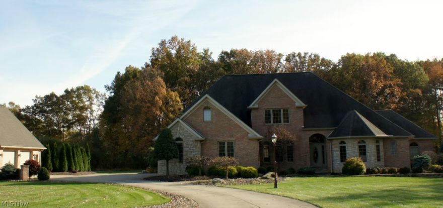 STUNNING STONE & BRICK HOME IS METICULOUS & WON'T LAST LONG! SITUATED ON BEAUTIFUL WOODED LOT W 3.8 ACRES, THIS 4/5 BEDROOM HOME ALSO FEATURES A FIRST FLOOR MASTER SUITE & BATH WITH A 17X14 CLOSET! UPON ENTERING THIS BEAUTY, YOU ARE GREETED WITH HARDWOOD FLOORS IN THE FOYER, FORMAL DINING ROOM, AND LIBRARY. THE GOURMET KITCHEN IS COMPLETE WITH A LARGE ADJOINING DINETTE AREA AND PLENTY OF WINDOWS OVERLOOKING A PICTURESQUE BACK YARD. GREAT ROOM HAS VAULTED CEILINGS UP TO THE 2ND FLOOR AND COZY FIREPLACE. SPACIOUS FIRST FLOOR LAUNDRY W/ CLOSET AND CABINETS. ADDITIONALLY, THIS PROFESSIONALLY LANDSCAPED HOME HAS AN ATTACHED 3 CAR HEATED GARAGE AS WELL AS A DETACHED HEATED 2 CAR GARAGE WITH SQ FOOTAGE ABOVE. WONDERFUL FLOOR PLAN WITH QUALITY THROUGHOUT. TRULY A MUST SEE. MOVE IN AND ENJOY!