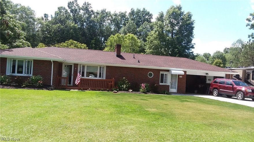 Beautiful home, inside and out.  Truly move-in ready.  Many updates in the last ten years.  Third bedroom is currently being used as an office.  Lots of closet and storage space.  All appliances, including the washer and dryer, remain and are five years old or less.  Gorgeous landscaping on the flat 1 1/2+ acre lot.  Large deck for summer entertaining or relaxing with access from the family room and kitchen.  Two car attached garage and a detached two car garage!  The detached garage was rebuilt from existing frame about five years ago.  Sellers are offering an America's Preferred Home Warranty to the buyer.  This is a must see all brick ranch.