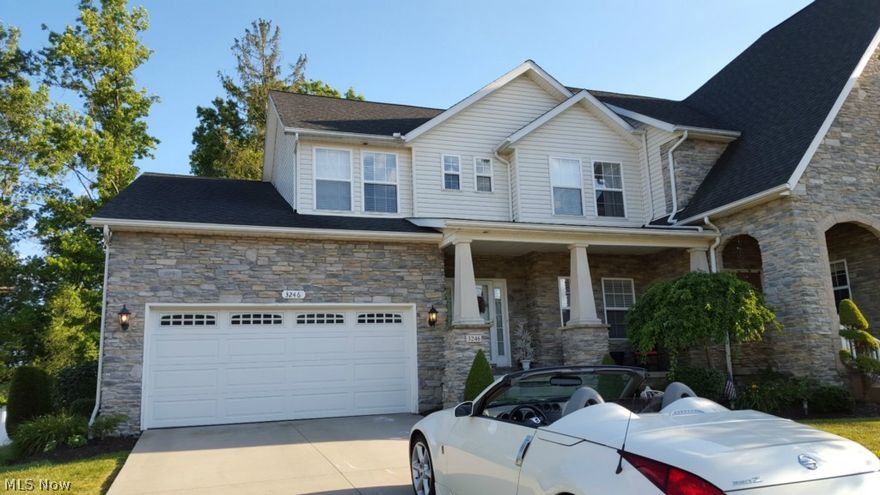 Absolutely GORGEOUS Show Home: Cuyahoga Falls Utilities. Woodridge School District! 2 miles from new Portage Crossing Shopping Center. Outdoor Maintenance Free! Cluster home status NOT condo. One owner! 2 Master Bedrooms! 1st flr master w/ huge walkin closet & it's own Mstr Bathrm, Jetted Tub, separate shower rm & great natural light from many windows & plantation shades. 2nd flr Master Bedrm w/ huge walk in closet, sitting area & reading cove, or use as bonus room! Welcoming front porch opens to foyer w/ hardwood flooring; has 1st Floor Office w/ French Glass doors, great for home-based business, play room or your own office space. Large laundry rm has ceramic tile floor, laundry cabinetry w/ a lot of hanging space off hardwood hall to garage along w/ well-appointed half bath also with ceramic tile floor. Open floor plan Kitchen, Dining Room & Great Room gives this home an awesome feel with great layout! Kitchen has Cherry finished cabinets, stainless steel appliances & Butterfly Gran