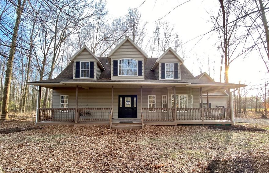 Come take a look at this 6 acres of wooded beauty, privacy, your own retreat. Huge pole barn with overhang, perfect for a livestock or a small business, or to store your vehicle(s) for a car enthusiast. Outbuilding has running water and electricity. This home has a beautiful first floor master bedroom, master shower, everything new from paint to flooring. Kitchen has quartz countertops, soft close cabinets. Everything in the house has been 100% updated and re-done.  Four bedroom home or you can use the fourth bedroom for a huge bonus room/office. Finished basement area, geothermal heat.  Almost 2600 sq feet with another 1600 finished in basement. Dual entry to basement. Awesome private landscaping in sandstone patio with fire pit, screened in porch with hot tub and wraparound porch. Great price for the size of house on 6 acres. This home won’t last long. Seller is a licensed real estate agent in the state of Ohio.