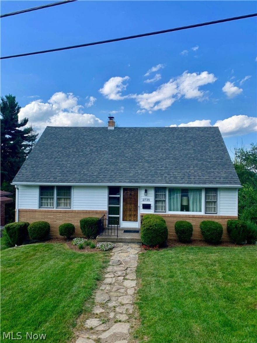 Cozy Cape Cod located in the highly-rated, award-winning Steubenville City School District.  You will love this home’s beautifully landscaped yard and its convenient, yet private setting. This spotless home features 3 bedrooms and 1 bathroom as well as second floor flex room that can serve as an office, playroom or a 4th bedroom. Kitchen updates include new vinyl tile flooring, new laminate granite-look countertops, a quality double bowl Elkay stainless steel sink, Insinkerator garbage disposal, and a self-venting, carousel GE Microwave Oven.  Bathroom updates include new wood-look laminate flooring, an American Standard, tall-profile, elongated toilet and a Eurostyle vanity. Interior finishes include warm hardwood floors, new custom window blinds, and neutral colors. The ready-to-finish 950 sf basement with integral one-car garage is dry and offers additional room to grow. The home also features a money-saving hybrid Carrier gas/heat pump forced-air heating and air conditioning system