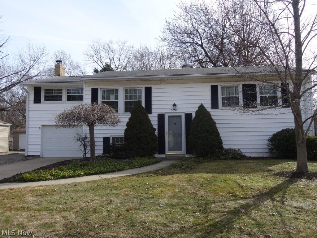 Lots to offer with this cute bi-level in the heart of Stow. Main living area features 2 bedrooms, kitchen, dining room, living room, and rec room. Basement is partially finished and walks out to back yard and the huge out building/workshop. Attached one car garage, sun room, and nice lot complete this package. Needs some TLC, but is a great value.