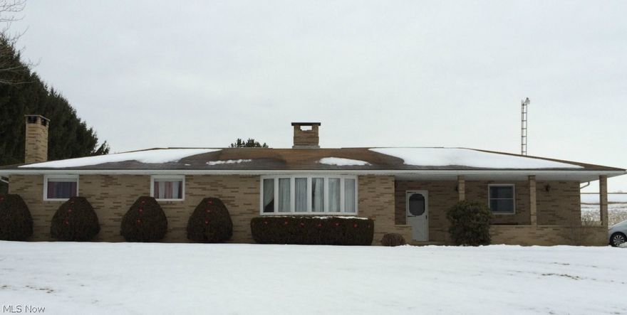 Beautiful brick ranch situated on almost 2 acres with a view of the country side.  Home features 3 bedrooms, two fireplaces and an additional 675 sq. feet in the partially finished basement consisting of a family room and rec room with a bar.  Carpeting in 3 bedrooms in 2015,  a newer septic pump, water softener in 2012, a detached 12 x 14 shed.  The basement fireplace features a heatilater which is capable of heating the entire home.    Enjoy a 24" above ground pool just off the back patio.  This wonderful brick ranch features a reverse osmosis water system and an allergen system for those with seasonal allergies.  The over sized two car garage has a gas heater.  One floor living at its best.  Mineral rights transfer with the property. Bar included.