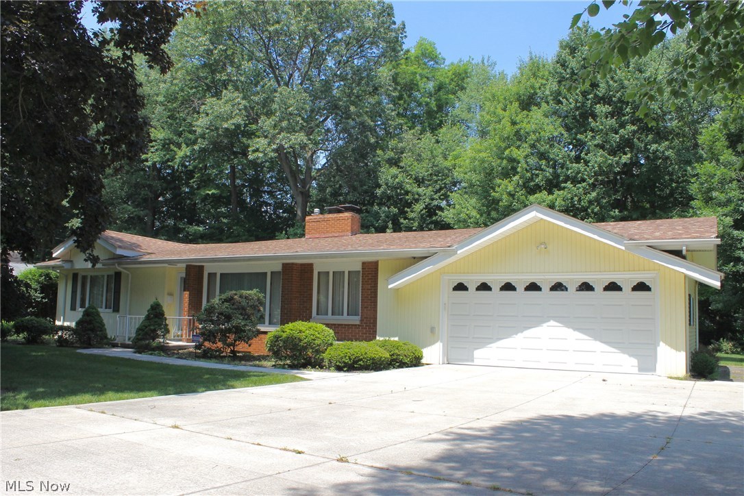 Come home to one of Kent's most popular neighborhoods and streets, Norwood! Set against a backdrop of trees and boasting wonderful curb appeal, this 3 bedroom, 2 Bath ranch has been meticulously cared-for by its only owner and now it is ready for your touches! Original Hardwood exists under Bedrooms, Family and Living Rooms! Kitchen and main floor baths are in excellent condition and all appliances remain. Living space is enormous... check out the total square footage of Living + Family + Rec Rooms! Some turn-key mechanicals/systems you will appreciate include: Newer Furnace AND Central AC (2012), newer roof (2008), newer washing machine, updated electric box, gutter guards (2011)... MORE! Basement waterproofing system is transferrable. Enjoy your quiet & private deck in the summer, the TWO Fireplaces (one wood burning and one gas) & your Heated Garage in the winter! Paved drive, newer curved sidewalk, newer entry doors and most windows (including basement glass block) help to round ou
