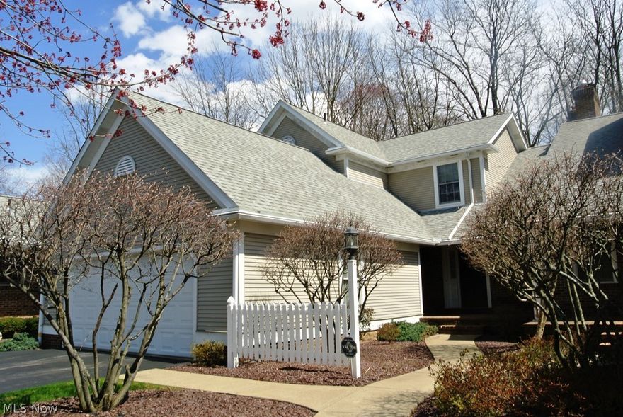 Fabulous location for this condo.  The white picket fence and cozy front porch welcome you in to the foyer entrance that takes you to the 2 story great room, featuring a floor to ceiling fireplace and large picture window.  The first floor is completed by a dining room, eat-in kitchen with plenty of counter and cabinet space, beautiful sun room with French doors to the patio, half bathroom and laundry room.   Master suite with walk-in closet and large bathroom with double sink and walk-in shower.  The guest bedroom has a full bathroom.  The basement has a rec room, 3rd bedroom, full bathroom and extra storage area.  There is also a 2 car attached garage.  Close to restaurants, stores, post office, banks, library and other conveniences.  This is a great place for simple, quiet living or elegant entertaining.  Make this your new home today!