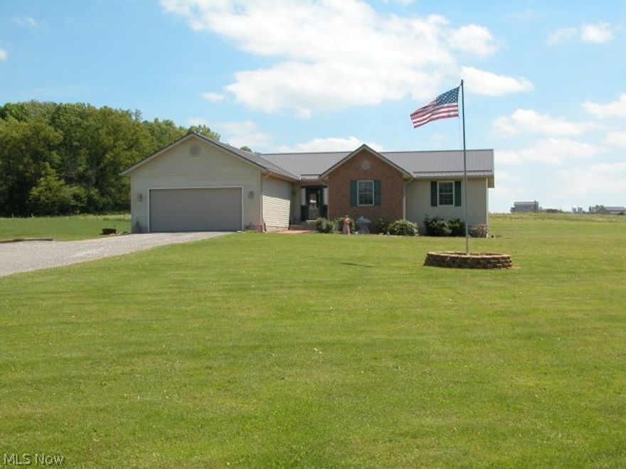Well maintained & cared for ranch home with terrific country views from front and back. Open floor plan w/very large living room open on sides to kitchen & dining room. Full basement finished with Owens Corning basement system, complete with full bath and plenty of storage. 10x20 composite deck-maintenance free. Many improvements & updates by owners including standing seam metal roofing, new water heater and natural gas line in 2015 converting from propane. Desirable area in Triway School District on 1.6 acres. 16x10 storage building. 1 year worry free home warranty to buyer.