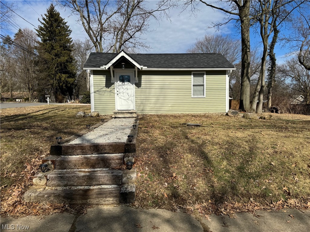 Attention "Tiny Home" Enthusiast's!!! Here is your perfect opportunity to own a completely rebuilt tiny home in the desirable Cuyahoga Falls! This home boasts all the upgrades anyone would want with efficient living at its best. Investor? No problem! This is a great opportunity to own an annual rental or even "Air BnB" in a highly desired area. This home may be small, but it is definitely mighty with its features and upgrades. Granite counter tops, luxury flooring, tile shower, along with new windows, siding and roof just to name a few. The possibilities are endless with this double corner lot. Call your favorite Realtor to schedule your showing today!