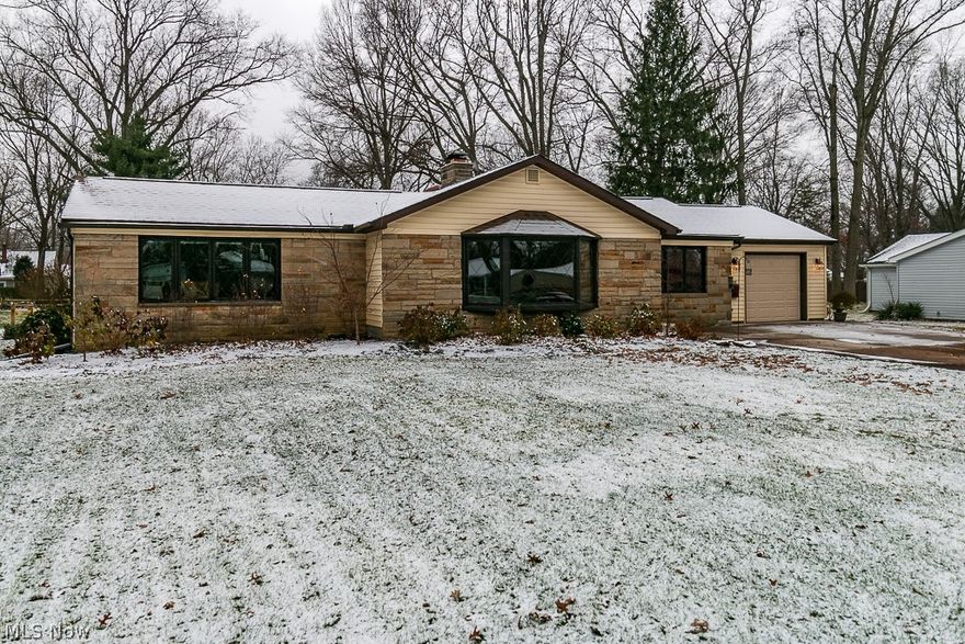 Great Mentor Ranch with all the right updates on Half Acre lot! Enter home into the large multi use living room with space available for an office or dining room. The master bedroom comes complete with updated en-suite and walk in closet. The additional two bedrooms are neutral and have sleek laminate flooring. You will find a second full bath that accommodates the bedrooms.  The large eat in kitchen has plenty of cabinet and counter space, and even a large pantry. Just off the kitchen is the over sized laundry/ mud /utility room where you can access your private patio. The over sized shed will allow for the extra yard storage. Recent updates include Anderson Windows, Roof, Furnace, AC, Hot Water Tank, Flooring and Appliances. Home comes with 1 Year Home Warranty. This home is a must see!