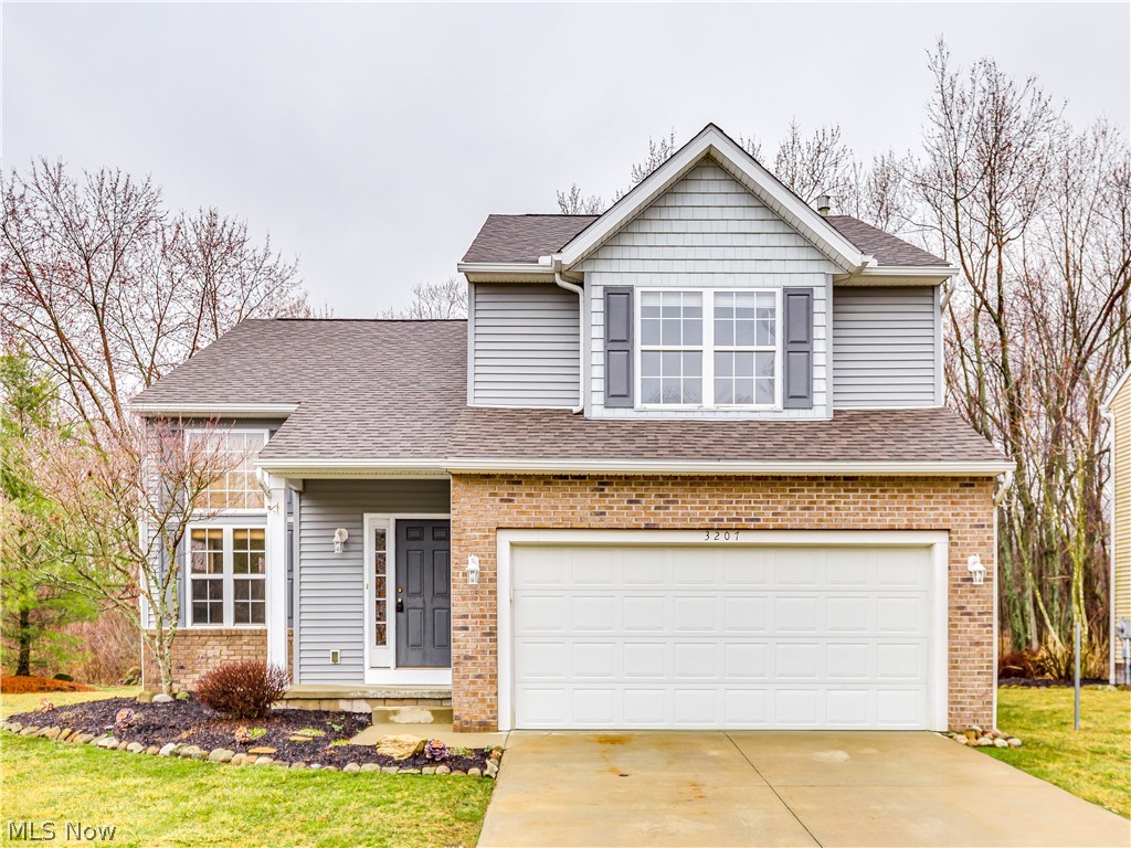 Don't miss out on this beautiful 3 bedroom home nestled up to the woods in the wonderful Lakes at Brittany Pointe. This home is unlike any other with it's features as this was the model home for the development. As you walk into the large kitchen you will find new appliances, an informal dining area that overlooks the beautiful tree lined backyard and a sliding door that allows you to enter your very own piece of serenity! An over sized living room with a fireplace, room for a formal dining room, half bathroom, lofty ceilings and windows as high as you can see! Upstairs features a catwalk that connects all three supersized bedrooms as well as the completely up to date full bathrooms. The master bedroom features a huge walk in closet, a master bathroom with everything you will ever want in a personal space! Downstairs is ready to make it your own with a large rec room that includes another half bathroom, built in storage for media and a storage room with all the major components includi