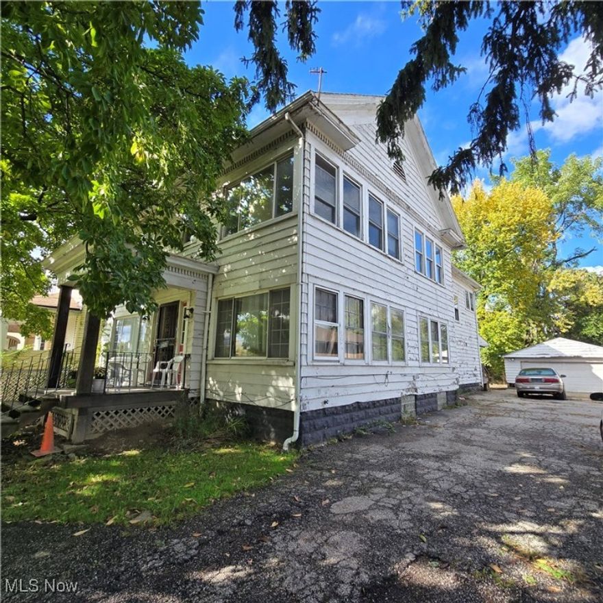 Very large two family with three bedrooms/1.5 baths and a sun/family room in each unit. Owner has lived there for many decades. Needs some work and remodeled. Very large lot. Two car detached garage.