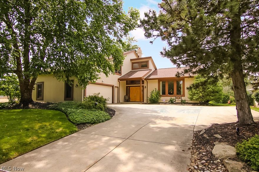 Ultra chic and contemporary split level, a true must-see!  Loads of updates and decorated in today's color palette. Open floor plan with soaring high vaulted ceilings and large windows offering lots of natural sunlight. Large eat-in kitchen featuring skylights and island with bar seating that overlooks the family room. Through the kitchen and family room sliding glass doors, you're welcomed by the deck overlooking the large, tree-lined backyard. Four bedrooms and three full bathrooms offer extra space for the growing family.  The master suite is equipped with a full bathroom and walk-in closet. Laundry on the main floor for your convenience. Two car attached garage.  Minutes from shopping, restaurants, and many more amenities.  Close to Beachwood Mall, Legacy Village, and La Place shopping centers.