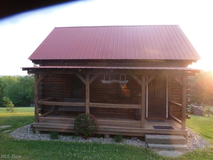 Remarkable 1.5 story log cabin located in a beautiful country setting, 3 minute walk to the Lake. Terrific yard with covered pavilion, nice fire pit, and cute outhouse looking storage shed. Lovely front covered porch and covered rear deck. Freshly stained exterior. The home features a eat-in kitchen, a living room, one full bath, and one huge bedroom upstairs that could be 2 with one being captured. Fully furnished except some antiques that belong to the owner. Seller to retain mineral rights.