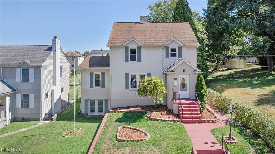 Welcome to this charming three, potentially four bedroom, two-bathroom brick home, nestled in the desirable Marland Heights neighborhood of Weirton. Only 24 miles from Pittsburgh International Airport and 4.6 miles from Steubenville, OH, this home is brimming with character and offers a unique opportunity for the right buyer to bring new life and love to a cherished abode.
Built in 1937, this home exudes timeless character and charm with its classic architecture and warm, inviting spaces that have been lovingly maintained over the years. Enjoy an abundance of storage with convenient built-ins throughout the home, adding both functionality and character to every room. The property features a spacious, fenced-in backyard, ideal for pets, gardening, or outdoor entertaining. A large detached garage provides ample space for parking and additional storage, making it a practical addition to the property. You can truly feel the love and care that has been poured into this home since its construction. Current owners are ready for the right buyer to continue to enhance its former glory and infuse it with new memories. The owners say just part of it's charm is the friendly neighborhood in addition to so many other features of the home. This brick home on Marland Heights is a rare find, offering a blend of character, convenience, and even income potential. With a separate side door entrance, the lower level could easily be converted to a mother-in-law or guest suite, a rental space or perfect for anyone that just wants the privacy of their own separate living space. You'll  be delighted to find a three quarter bathroom with a shower, a kitchenette, additional living area including that space for a fourth bedroom, as well as a large workbench area near the laundry. Hurry, this gem will soon to be snatched up!