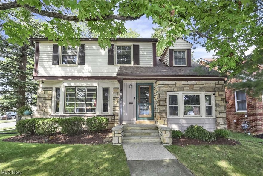 Not your everyday cookie cutter home, centrally located in a desirable Parma neighborhood. This special property features a massive front room with wood floors, wood burning fireplace and bay window, opens to the dining room with slider to a large deck overlooking a beautiful and fully fenced backyard. Excellent flow to the updated galley kitchen with off-white cabinetry, granite counters, glass backsplash, recess lighting and wood floors. Back entry foyer serves as a pantry or mud room or both. Not one but two additional bonus rooms on the first floor really set this home apart and provide many options, currently used for home office and playroom. Incredible master bedroom spans the length of the first floor living room, features wood flooring, built-in display shelving and walk-in closet with walk-up attic access. Second bedroom overlooks the backyard and character abounds as you step down into the third bedroom with built-ins flanking a dormer nook. All have hardwood, good size clos