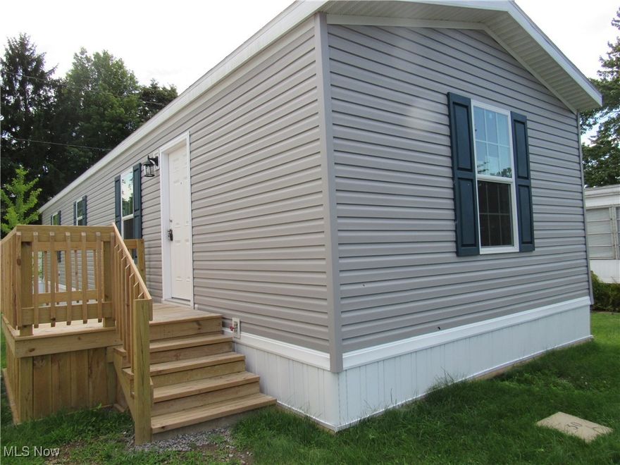 What a great opportunity to own a new home (built 2024) at an affordable price! This home has two bedrooms and two full bathrooms, an open floor plan with plenty of storage! The eat-in kitchen features a breakfast bar, a new dishwasher, stove and refrigerator and loads of cupboards! The split floor plan has one bedroom and full bathroom on one end and an owner's bedroom with a spacious walk in closet and an en-suite bathroom. The laundry is tucked off the hallway and includes a new washer and dryer and access to a side entrance and small deck. There is a larger deck off at the front door. This home also includes a one year home warranty for piece of mind for it's new owners! Homestead Village is located close to highways, restaurants and shopping. Call today to see your new home!