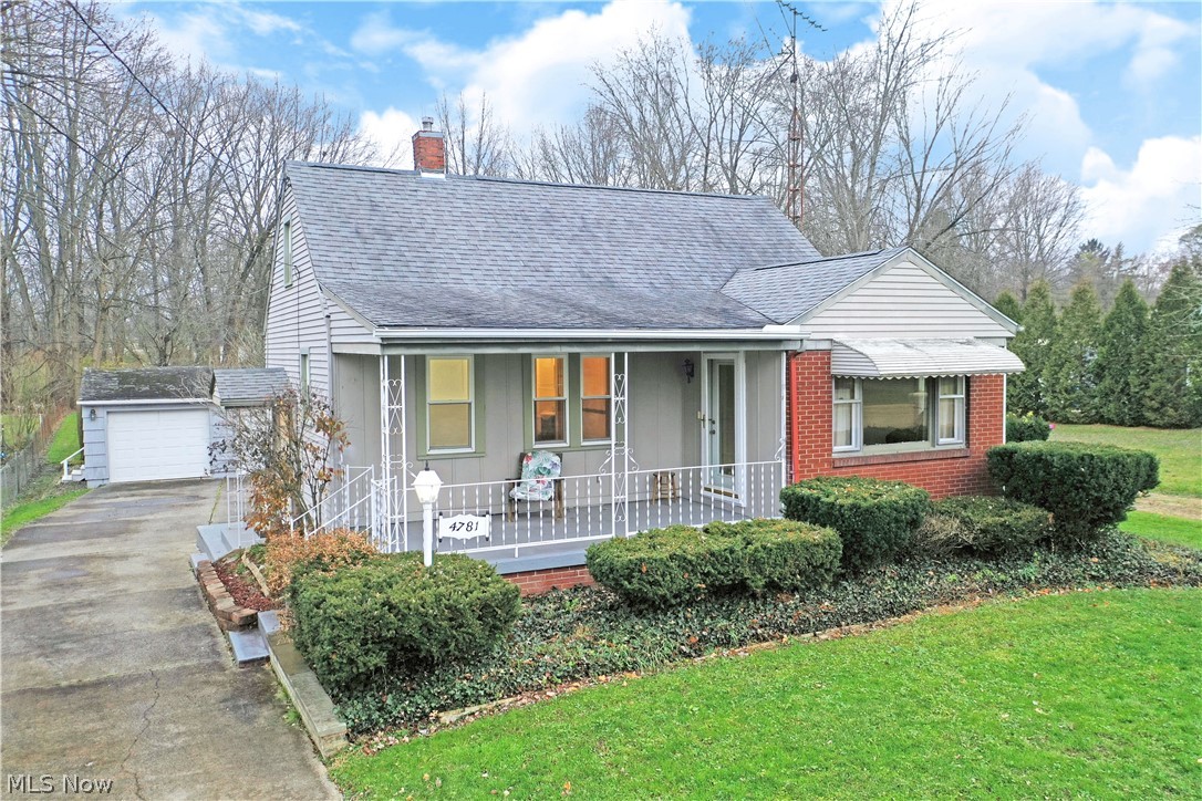 Perfectly charming and move-in-ready, this cozy Champion cape-cod is a must see! With its relaxing, covered front patio and brick accent work, the residence easily catches your eye with its alluring curb appeal. The delight continues around back as the concrete driveway reveals a sizeable, raised deck surrounding an above ground pool before finding an oversized, detached two car garage with additional storage space built into the rearward portion. Offering a casual side entry for day-to-day use, the formal front entrance provides a decorative glass entry door that combines with the large picture window to illuminate the spacious living room. Hardwood styled flooring runs beneath as stained wood trim runs along the baseboards and window casings. A central dining room splits both the kitchen and main hall, found just around the corner. Inside the kitchen, brightly lit cook space is accented with marbled counters and a dark, split basin sink that contrasts the bright white cabinetry. Along the rear hall, flooring transitions to traditional hardwoods as they fill the rear foyer before spilling into the first-floor master bedroom. A tastefully updated bath joins at mid hall with lovely tile work and a stylish vanity. Upstairs, additional loft living space bestows a unique den partition that overlooks the bedroom and walk-in closet. 2-10 Home Warranty included!