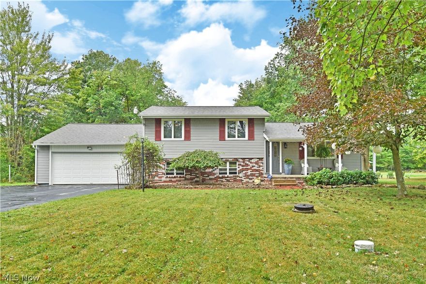 Tucked away in a scenic, semi-rural Southington location, this fantastic split level absolutely delights from top to bottom with its three floors of gorgeous living space plus basement storage! If that doesn’t intrigue you, don’t miss the fenced in backyard with its inground pool and multiple patio locations for summertime fun. Step inside to find stylish, modern design choices and tasteful updates as the welcoming foyer opens to a tall ceilinged great room that overlooks a brick mantle with faux fireplace. A picture window spills natural light across the floors as it transitions through the dining portion and into a brightly colored sunroom with backyard access. The stunning kitchen sits center with intricate cabinetry and glass tiled backsplash that dances under the cabinet lighting. Upstairs, three ample bedrooms offer clean aesthetics as the third presents as a must-see dressing area. A full bath continues the trend mid hall with its attention to detail and perfectly presented show