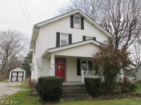 3 bedroom 2 story home with fireplace in the living room and sliding glass doors in DR leading to back deck...2 car detached garage and full basement.
