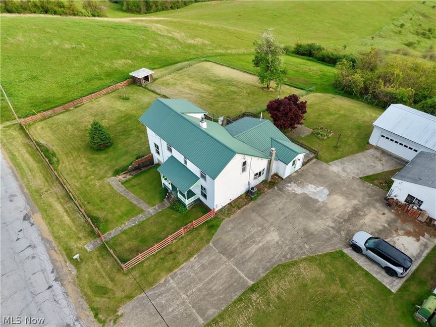 3 bedroom, 2 full bathroom with nearly 2,300 square feet just on the outskirts of Barnesville. Located across from the Barnesville-Bradfield Airport, this house sits on two parcels of land totaling just under 1.1 acres. Side yard is fenced with chain link and would allow for easily letting your dog outside. Very nice 45' x 26' pole building built in 2011, complete with woodstove that will stay. Metal roof on house approximately 13 years old. Furnace and central air are about 11 years old. New septic and leaching installed by Cook in the summer of 2014. Mineral rights are not leased and seller will transfer anything owned.