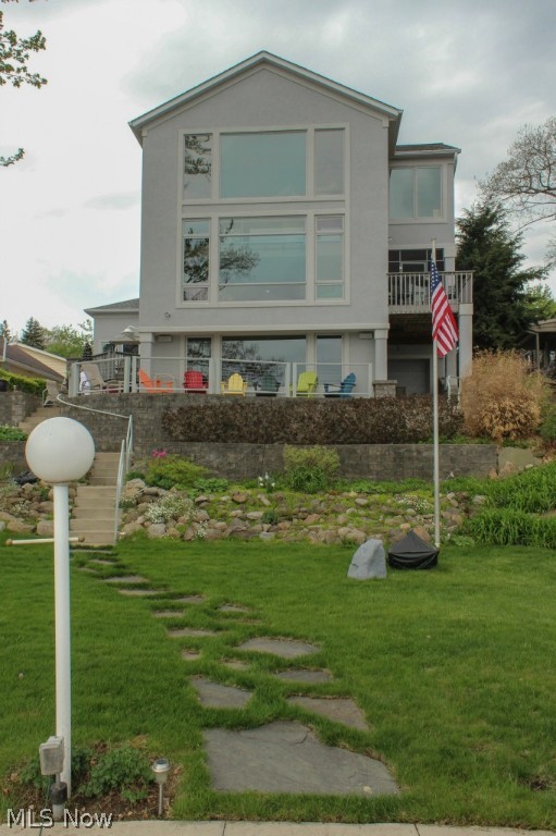 Waterfront Custom built home in 2006. Awesome views of the lake from floor to ceiling windows. Great room with fireplace open to gourmet kitchen, granite counter tops, sub zero refrigerator and freezer, center island breakfast bar. Stunning master suite and glamour bath. Family room with bar, exercise room and full bath on walk-out lower level. Office, sun room, 1st floor laundry room with loads of storage.