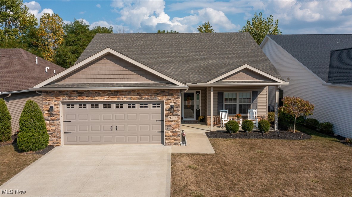 Welcome to Seville and this beautifully maintained 2016-built ranch offering the perfect blend of comfort and style. This 3-bedroom, 2-bath, pond waterfront home features an open floor plan with 9 ft. ceilings, and abundant natural light throughout. The family room is anchored by a cozy gas fireplace, while the upgraded kitchen offers maple-finish cabinets, granite countertops, and luxury vinyl flooring that flows through the main living areas. The four-season sunroom with barn doors is a peaceful retreat, complete with custom blinds and gorgeous views of the pond and trees that provide privacy. Step outside to the patio to enjoy nature at its best with this waterfront location! The spacious owners' suite includes a huge walk-in closet and a private bath with an upgraded one-piece shower. The second full bath is generously sized, making it ideal for family or guests. Fresh, neutral paint throughout enhances the bright and airy feel. The garage includes more than parking. Within the garage is an enclosed, heated workshop/craft area with its own sink ... perfect for hobbies or extra storage year-round. Outdoor living is easy with a covered front porch and a private backyard setting. Located in an ideal spot within the development, this home offers tranquility while being just minutes from I-71, Route 224, and the charming shops and dining of downtown Seville. A low monthly HOA of just $125 per month covers, among other things, landscaping and snow removal, providing ease and peace of mind. With thoughtful upgrades, one-floor living, and an unbeatable location, this home is ready to welcome you!