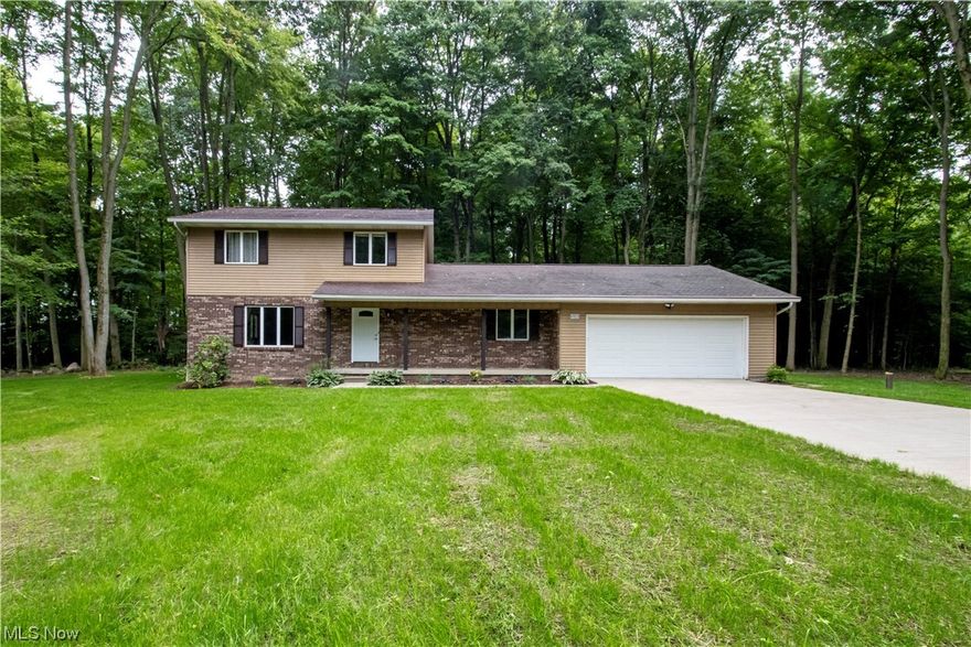 Country setting on wooded one acre lot.  Lots of room in this updated home located in Norwayne School District.  Through the front door, to your right is an office/study that could also be used as an additional bedroom.  Going down the hall and into the large open kitchen area with room for a kitchen table that overlooks the fireplace in the family room area.  More family living space on the other side of the newly renovated kitchen that could be used as a formal dining area.  Laundry is located on the first floor as you walk in from the garage.  Upstairs there are three bedrooms with a primary suite and a hallway full bathroom.  Lower level is partially finished, with a large open space as well as a separate room that is located at the bottom of the steps.  Oversized two car garage and new deck in the back yard.  Many updates in this home over the last year, all bathrooms have been renovated along with a completely new kitchen.  Almost all new flooring, lighting, paint, and cabinetry throughout.