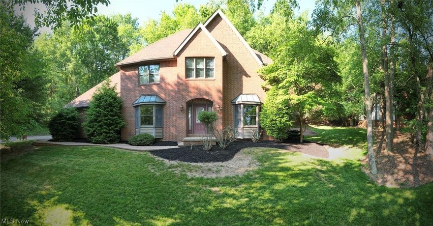What do you say about this gorgeous four bedroom, three full and one-half bath colonial home. WOW! Come on in to see the beautiful foyer and into the inviting living room offering bay of windows to let the natural light shine through, large dining room, family room that has natural wood built in cabinets, fireplace, and is open to the stunning eat in kitchen. The kitchen is a chef's delight that has an island with cook top, double sink, double oven, refrigerator, microwave, abundance of cabinets and counter space, built in desk. A door that leads to the back area. New carpet (2023) through the first floor and upstairs. Half bath, and laundry area with sink finishes the fabulous first floor. Upstairs you will find four bedrooms, the master offering two walk-in closets, corner area for sitting, office, etc and a full bathroom with his and her sinks, tub, and shower. There is a full bathroom again offering his and her sinks, and shower. The finished lower level has plenty of room for an o
