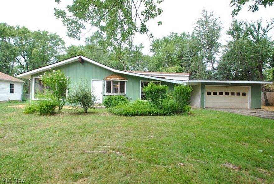 Your appreciation will start as soon as you open the front door to this air conditioner, mentor ranch with its open look, hardwood floors, beams, vaulted ceiling, and wood burning fireplace with windows all around. This home has hardwood floors throughout. Full baths. 3  bedrooms, with possibly a fourth with your imagination, and all the extra square footage that's available. The Kitchen attached to the great room has a wide open look, beautiful granite counters, with a snack bar seating. All appliances, stay. The sunroom has hardwood floors, windows all around, overlooking the yard vaulted ceiling with a skylight that opens, and a gas fireplace to enjoy the warmth and winter snowfalls. The sunroom also has a separate entrance and access to the attach 2 car garage with opener. The home is close to shopping, schools, and community centers. The yard features additional parking if needed for campers or boats, and plenty of room for children to play.