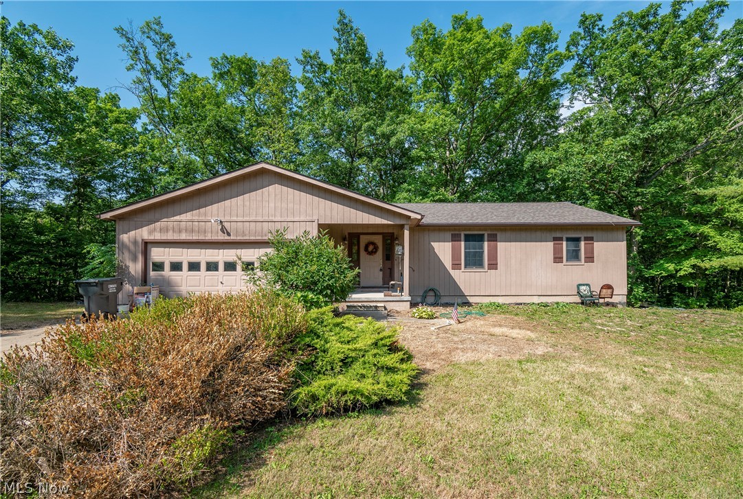 Welcome to 5011 State Route 14! 1600 sq ft ranch sitting on an amazing 13 acre lot! Long treelined driveway opens up into your private peaceful property. The main level provides an open floor plan with a spacious kitchen and dining area. Glass doors from the dining space give access to a large deck with stairs to the gorgeous wooded back yard. Cozy living room boasts a wood burning fireplace and tall windows providing loads of natural light. Full bath attached to the owner's bedroom. Two remaining great sized bedrooms with large closets and second full bath round out the main level. Full basement with walkout to the side yard. For all the avid fishermen and boaters, this home is conveniently located just a half mile from West Branch Reservoir! Don't miss your opportunity to own this home. Schedule your private viewing today!