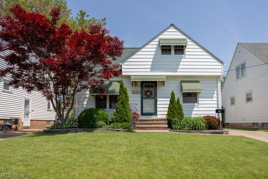 Welcome Home! You won't be disappointed when you step into this immaculately well-kept bungalow. You'll love the original hardwood floors throughout the house and the TWO updated and remodeled FULL bathrooms. There are two generous sized bedrooms located on the main floor and upstairs you'll find a large master bedroom with a cedar-lined, walk-in closet. In the basement there's even more living space, including a kitchenette. This space would make a wonderful in-law or guest suite or a great media room. The eat-in kitchen on the main level features Corian countertops and updated finishes. Enjoy beautiful summer evenings in the lush backyard with large patio space. All of the big-ticket items are already done: Replacement windows, driveway, interior doors, attic insulation and newer roof. Furnace and hot water heater installed about 2008. All appliances stay, including the refrigerator and stove in the basement. Most furniture is negotiable. 1-year Home Warranty included.