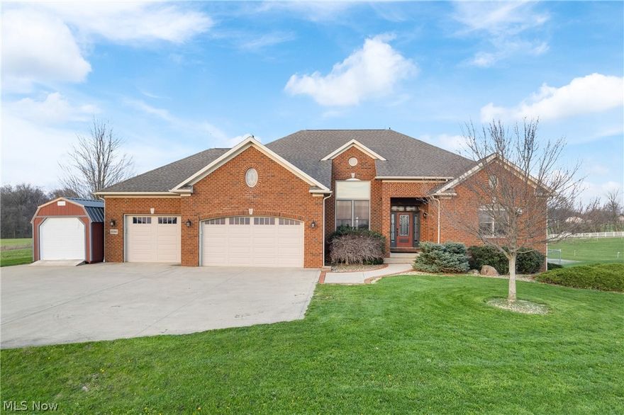 *ALSO AVAILABLE AS HORSE FARM ONLY WITHOUT HOUSE - SEE MLS #5200357!* Welcome to this distinguished, turnkey equestrian estate offering a rare blend of luxury living and professionally designed horse facilities. The completely updated 3 bed, 4 bath, all-brick residence spans over 3,700 square feet & offers a fully finished walk-out basement. New, high-end finishes define every space, including an impressive & fully remodeled chef’s kitchen with hidden butler’s pantry, an elegant primary suite with a grand walk-in closet room, & private deck capturing sweeping views of the farm. A beautiful stone natural gas fireplace & soaring ceilings accentuate the main living area, with incredible hardwood floors throughout the entire first floor. The equestrian amenities are exceptional and meticulously maintained. A 70x140' heated indoor riding arena, expansive 100x300' outdoor arena, and professionally designed mountain trail course create endless training opportunities. The main barn offers 27 indoor stalls, each equipped with automatic waterers and stall mats, plus heated wash stalls, 3 heated tack rooms, multiple feed rooms, and heated bathroom. An additional 8 exterior shed-row stalls and numerous safely fenced pastures and all-weather turnouts—all with automatic waterers—ensure optimal functionality and horse safety. The property also includes 10+ acres of alfalfa/timothy hay fields, enhancing operational efficiency, and a 1 bedroom/1 bathroom apartment, ideal for farm help or trainer accommodations. Additional details include RV parking and hookup, workshop area, EV charging station, dog washing station, generators, free internet, hay storage for 2400+ bales, additional 5 acre lot option, and so much more! Every element of this property has been thoughtfully streamlined for comfort and performance. This estate stands among the NE Ohio's most complete and refined equestrian offerings - a truly unparalleled opportunity for the discerning horse professional or enthusiast.