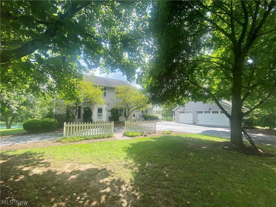 Lovely country chic farmhouse with beautiful views.  Located in Smithville School District in the community of Fox Knoll Estates.  This 3 bedroom, 3 bathroom home is ideally situated on a beautifully landscaped lot with lake views! Recently renovated kitchen, hardwood flooring, brand new HVAC, and a finished lower level with a family room and exercise room.  The exterior is complemented by the 3 car garage, additional outbuildings, pergola, multi decks and patio areas, all adjacent to the common area of Fox Knoll Estates which is ideal for relaxing, picnicking , and fishing!