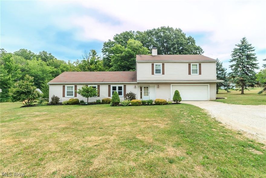 NICE AREA!  NICE PRICE!  THIS LOVELY COLONIAL OFFERS FOUR BEDROOMS AND ALL THE AMENITIES!  MODERN KITCHEN, FRESH PAINT COLORS, NEWER LAMINATE FLOORING THROUGHOUT AND A COZY PELLET STOVE IN THE DINING ROOM.  THIS HOME BOASTS LOADS OF LIVING SPACE WITH JUST UNDER 2,200 SQFT.  THE HOME IS SITUATED ON TWO-PARCELS FOR A TOTAL OF 0.83 OF AN ACRE.  THE ATTACHED TWO-CAR GARAGE HAS PLENTY OF PARKING SPACE.  THE LOFT AREA HAS A CLOSET AND COULD EASILY BE CONVERTED INTO A FIFTH BEDROOM.  THERE IS A STAMPED, FRONT CONCRETE PATIO AREA AND REAR SLIDER LEADS TO ANOTHER PATIO.  OPPORTUNITY - A FINE HOME IN PERFECT CONDITION!