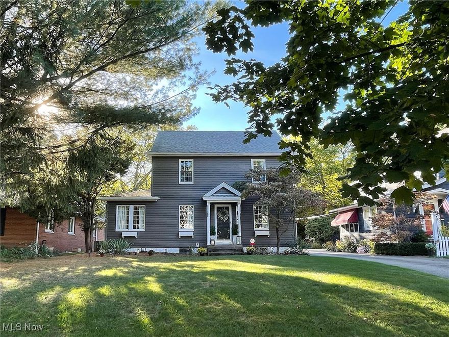 Love, care and good taste are the hallmarks of this gorgeous colonial in West Akron's sought-after Castle Park neighborhood. Brimming with character, and the compliment of carefully-chosen updates, the home will be one you'll want to make yours for a very long time. From the curb, you'll see a lovely tree-lined street and pampered yard. Upon entry, you have terrific sight lines of the 1st floor. You're welcomed by a lovely sitting area with built-ins that leads perfectly into a light, bright living room with lots of windows and natural light, a gorgeous dining room, comfortable family room and bright 3-season sunroom, which both open to the rear yard and patio. You'll have wonderful outdoor parties, here.The kitchen was very important to the owner. She had it remodeled wth a mx of modern, versatile cavinetry, including large pot and pan drawers, soft-close elements, arabesque tile backsplash, wall-mounted television, and with the kitchen island it's large enough for the cook and a couple of helpers, too! With every imaginable convenience, you'll wonder how you did without it. The second floor has a lovely master suite with three closets and a remodeled owner's bath. Two more good-sized bedrooms and an additional full bath nicely round out the second floor. Have a teenager who wants his or her own space? The third level can serve as a perfect space for a private bedroom or office. Improvements include a new electrical panel and flooring in 2025, water heater in 2022 and a full roof tear-off on the house and garage, with new gutters in 2020. Even more, the owner said she will miss the rare and precious sense of community, including wonderful public and private school options, and truly special neighbors out walking, running and riding bikes, who stop to say hello and who love being part of something special. Make plans to see this one today. You won't want to let it pass you by!