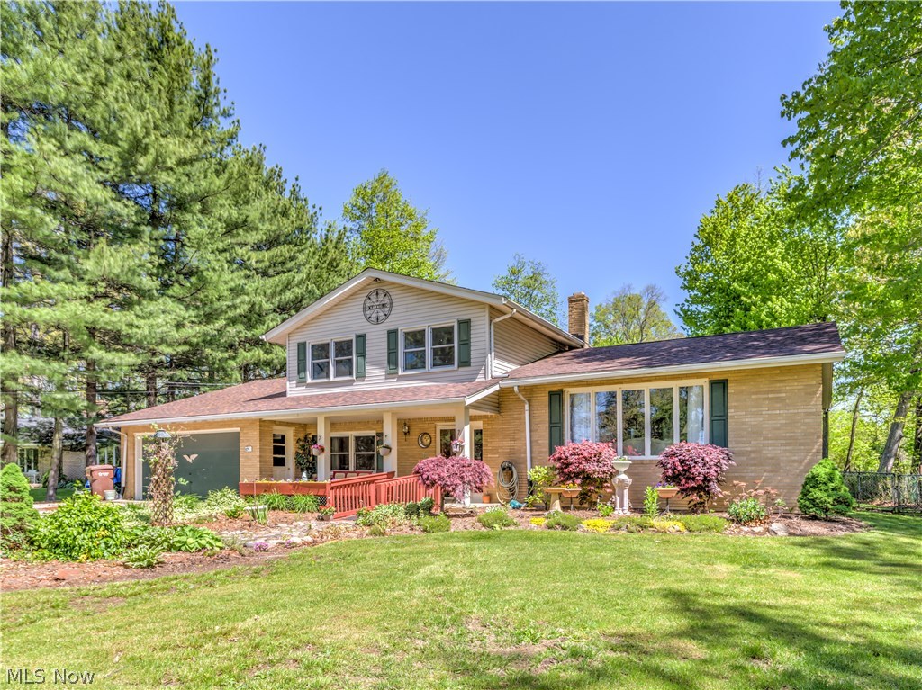 Wonderful 4 level split on tranquil approx. .9/acres with 4 bedrooms, 2 bath, approx. 1912SF, 2 car attached garage plus 24x50 pole barn* Approx. 2/3 brick exterior, replacement windows (except 3-living room, dining room & family room), shingles 2004, updated kitchen & bathrooms, 2 tier deck, fenced back yard & covered front porch* Screened porch with fireplace* Foyer entry with ceramic floor*. Vaulted living room & dining room* Kitchen with Kraftmaid cabinets, granite, gas range, microwave, refrig, dishwasher plus disposal, ceramic floor & access to 2 tier deck with pergola* Family room with fireplace with wood burner insert* One bedroom on 1st floor* 2nd level with 3 bedrooms and hall with wood floors* Water softener* Deck reinforced for hot tub* Well & Septic completed 9/2016* Home warranty provided*