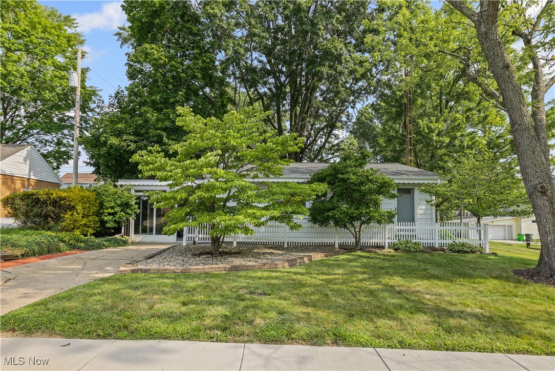 Don't miss out on this unique property nestled just down the street from the University of Mount Union! You'll love both the main living space AND the additional living space. The main house has a great layout with two bedrooms, living room, kitchen, and full bath. Updated kitchen with modern backsplash and stainless appliances, updated bathroom. Every detail has been thoughtfully maintained. Basement is unfinished. The extra living space is a perfect in-law suite, private suite for your college student, office space, home gym...the possibilities are as endless as your imagination! It includes what is currently being used as a bedroom, family room, kitchenette, and a second full bath. Carpet in the additional living space is about 5 years old. Additional refrigerator and range in this space are included, along with the LG wall-mounted TV and bar stools for kitchenette. This space has its own furnace and current owner uses a window unit for cooling (unit does not convey). BUT WAIT- There's so much more! The enclosed patio with sliding glass doors, just outside of the main living space and connecting with the extra living suite, is perfect for relaxing, entertaining, or enjoying this lovely neighborhood. Nice sized lawn and mature trees. Hot water tank 2014. Shingles on main house 2019 and roof over enclosed patio and additional living suite were replaced 2013. Gutters were done in 2020. Electric box was updated when purchased by current owner. Great opportunity to be part of an active and vibrant community! House is being sold in its AS-IS condition. All ages, sizes, and dimensions are estimated.