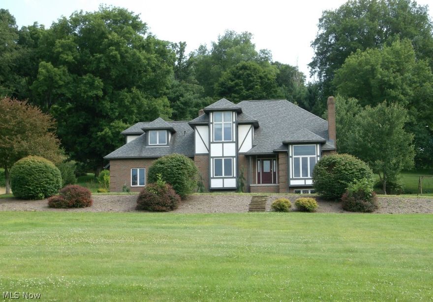 Convenient-desirable location on the edge of town in Port Washington Estates, coupled with impressive curb appeal can be found in this 3-4BR-3.5BA Tudor Style home situated on 5.6 acres!  Approximately 3384 square ft. of finished living area contained in this one owner home, custom built in 1995.  Large foyer leads to the formal living room w/fireplace which opens to the dining area w/built-ins and the large open kitchen/breakfast nook overlooking the family room w/fireplace.  The first floor also includes an office/study w/built-ins and half bath.  Upstairs is the M-BR complete with private bath and large walk-in closet as well as the additional 2 bedrooms, full bath and finished bonus room above the garage which also contains the second floor laundry. In the lower level can be found the spacious recreation room, full bath and other room which could be used as a bedroom.  The unfinished area of the basement is plumbed for another bath if you desire.  Solid Oak raised panel doors throu