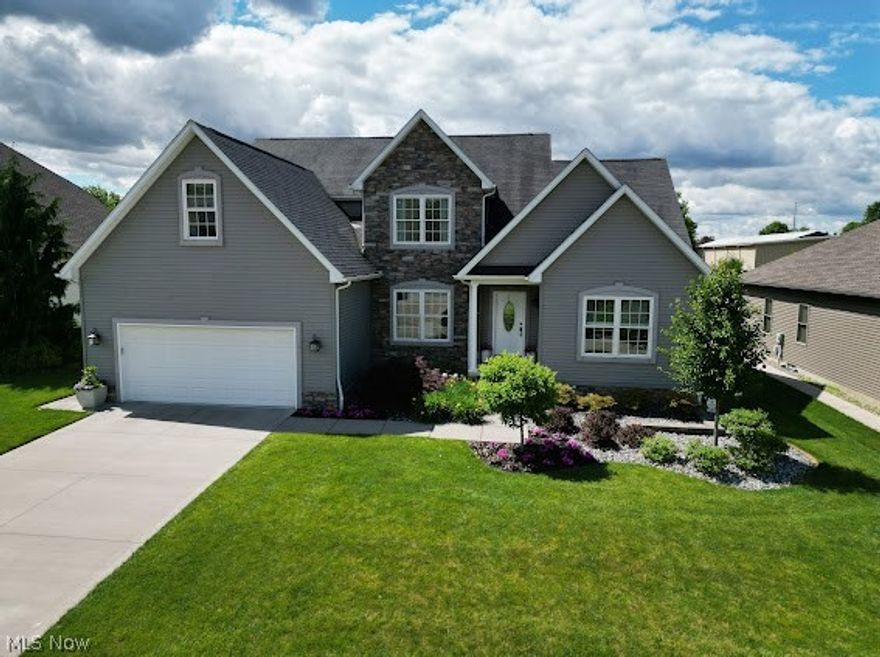 Stunning and impeccable is the best way to describe this amazing home. Step inside and be welcomed with a bright and airy foyer immediately drawing awareness to the great room where an amazing floor to ceiling brick fireplace will grab your attention. The spacious great room boasts an abundance of natural light flooding in from the expansive windows and opens into the sleek, modern eat-in kitchen offering stainless steel appliances, an abundance of cabinetry, Quartz countertops, large center island w/extra storage, modern lighting and a walk in pantry. The dining room presents a trey ceiling, impressive wall panel molding and crown molding with soft lighting giving an elegant dining experience. The comfy first floor master bedroom offers a recessed trey ceiling and boasts an abundance of natural light; the master bath provides double sinks, granite countertops, expansive rain shower, walk-in closet and linen closet, The first floor also offers a private office, a large half bath, generous laundry room and ample closets for storage. The second floor provides three large bedrooms w/walk-in closets. One of the spacious bedrooms provides a charming, cozy window seat. A large bath w/granite countertops and a seating area overlooking the great room completes the second floor. The extremely large, partially finished basement has endless possibilities. Step onto the inviting patio with meticulously laid pavers offering an abundance of space for entertaining, a perfectly laid firepit for warmth during cold evenings and flawless landscaping. A photocell-controlled landscape and home lighting system provides for an ambiance effect in the evenings. Absolute beauty, don't miss out!